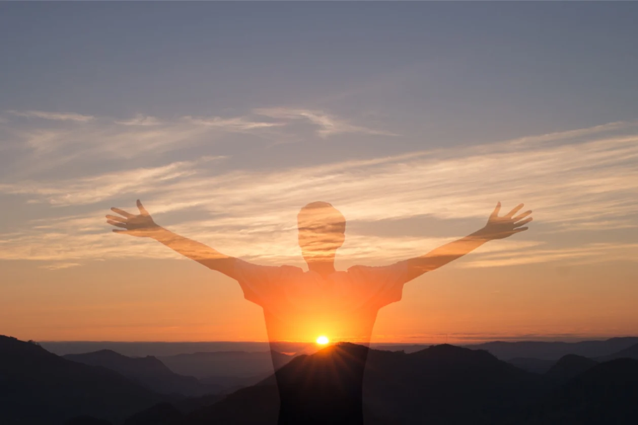 man with arms out wide during sunset-Marcio Binow Da Silva-iStock